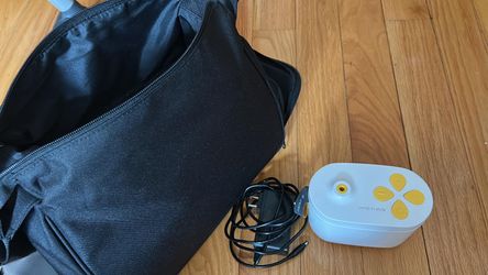 Medela In Style Pump with original cable and travel bag (used only once)