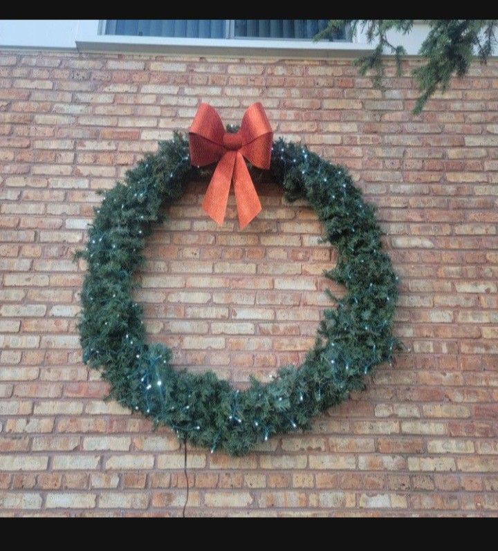 50 inch artificial LED light up wreath. I will also throw in a 24 inch artificial wreath for free.