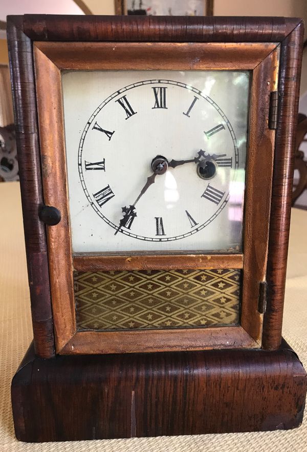 Antique wind up clock by Jerome and company manufactures of eight and