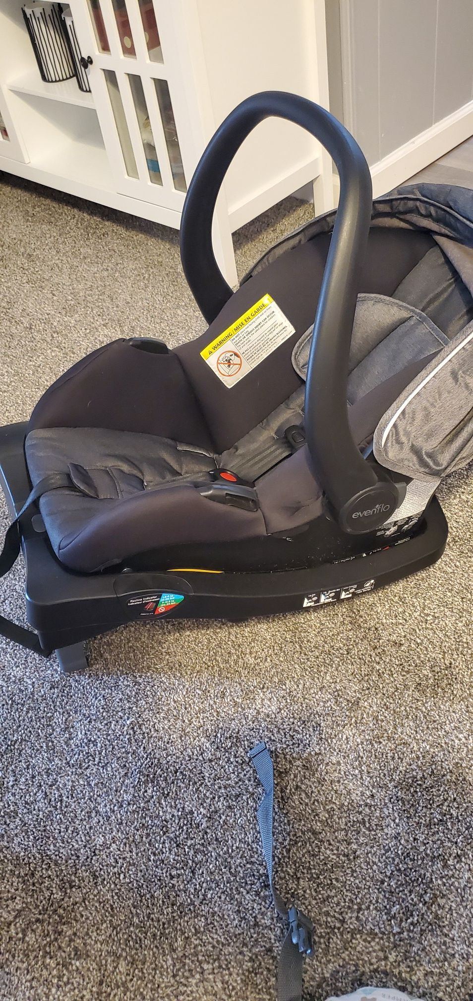 Evenflow infant car seat and base. Comes with winter cover, fall cover and 2 inserts w/ strap guards