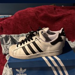 white adidas superstars (not free)