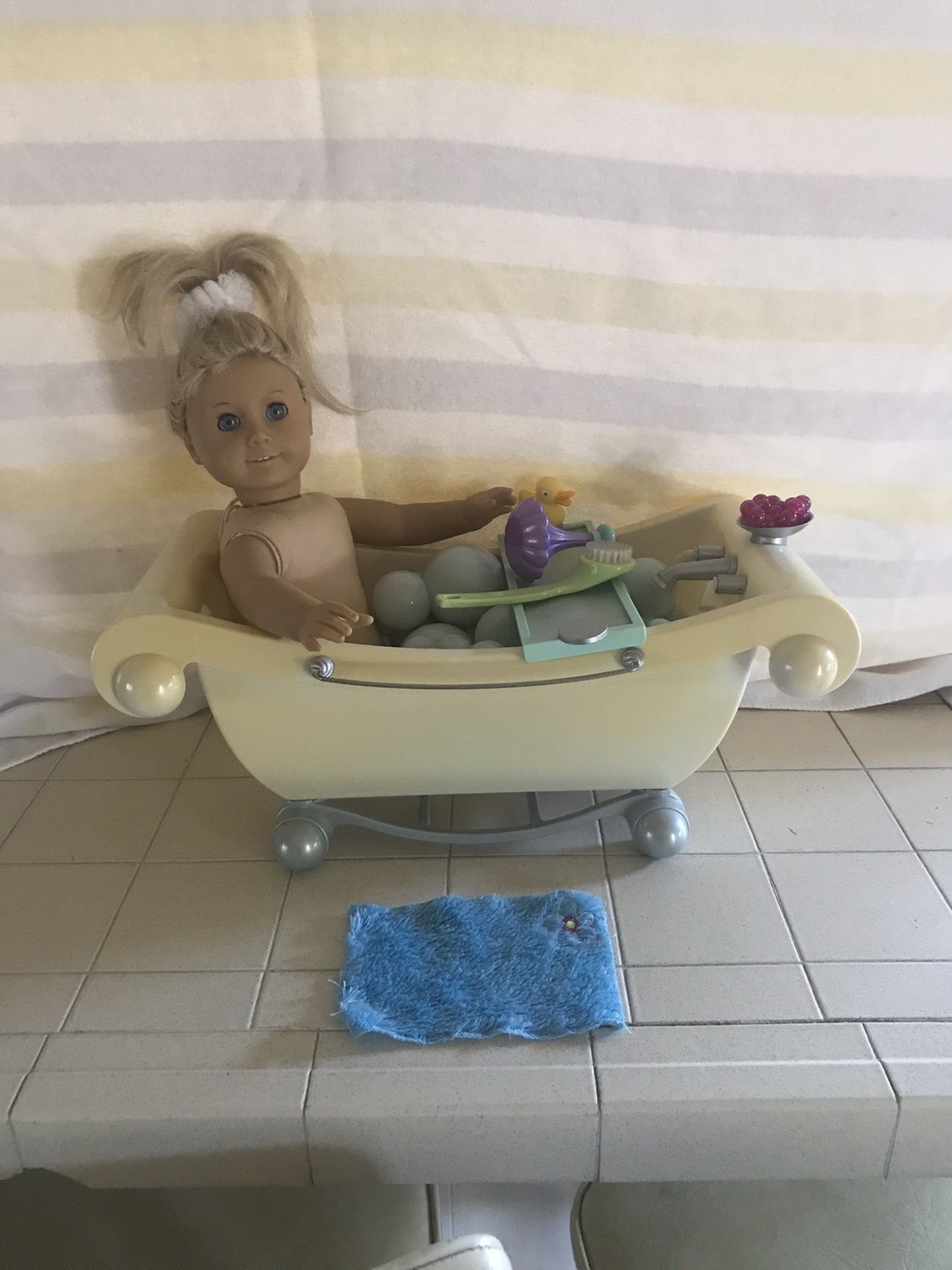 American girl doll and bathtub and accessories