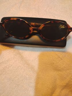 Miu Miu Tortoise Oval Sunglasses