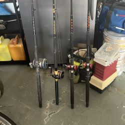 Two bottom fishing rods with reels and two bait sticks
