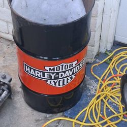 Harley Davidson, 55 gallon bucket or a drum used for a garbage can hollow at both ends.But can hold a garbage bag