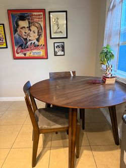 Wooden dining room table and matching chairs