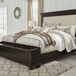 Brynhurst Dark Brown King Upholstered Storage Bed

