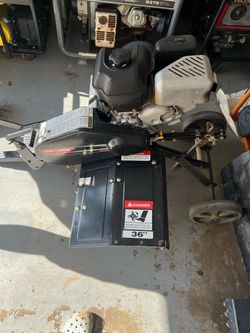 Craftsman 36-Inch Pull-Behind Tiller powered by a small gasoline engine