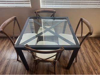 Table with four wooden chairs
