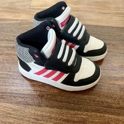 Adidas Hoops Mid Toddlers Size 10 10K Basketball Shoes Black Pink unisex   Black and white sneakers with pink stripe.  Unisex and can be worn by boys 