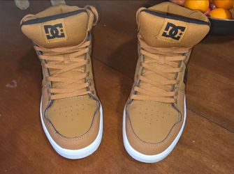 DC Shoes Cure Hi-Top sneakers in a wheat/tan colorway with a white sole.