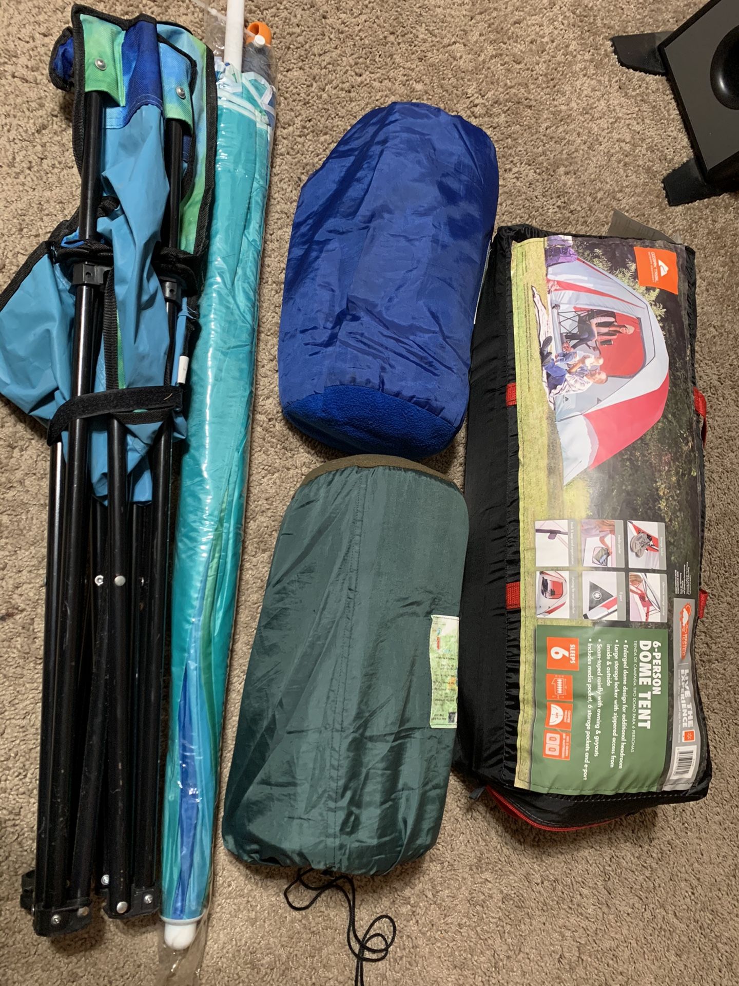 Camping gear (6 person tent, 2 sleeping bags, folding chair and umbrella ). MAKE ME OFFERS!