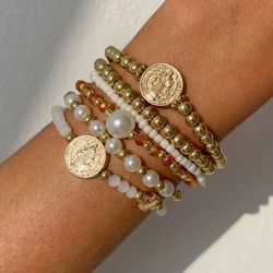  Layered gold bead bracelets, unlock the relaxed vacation vibe