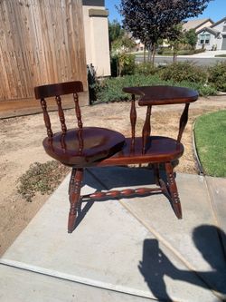 Antique “gossip” swivel chair with table.