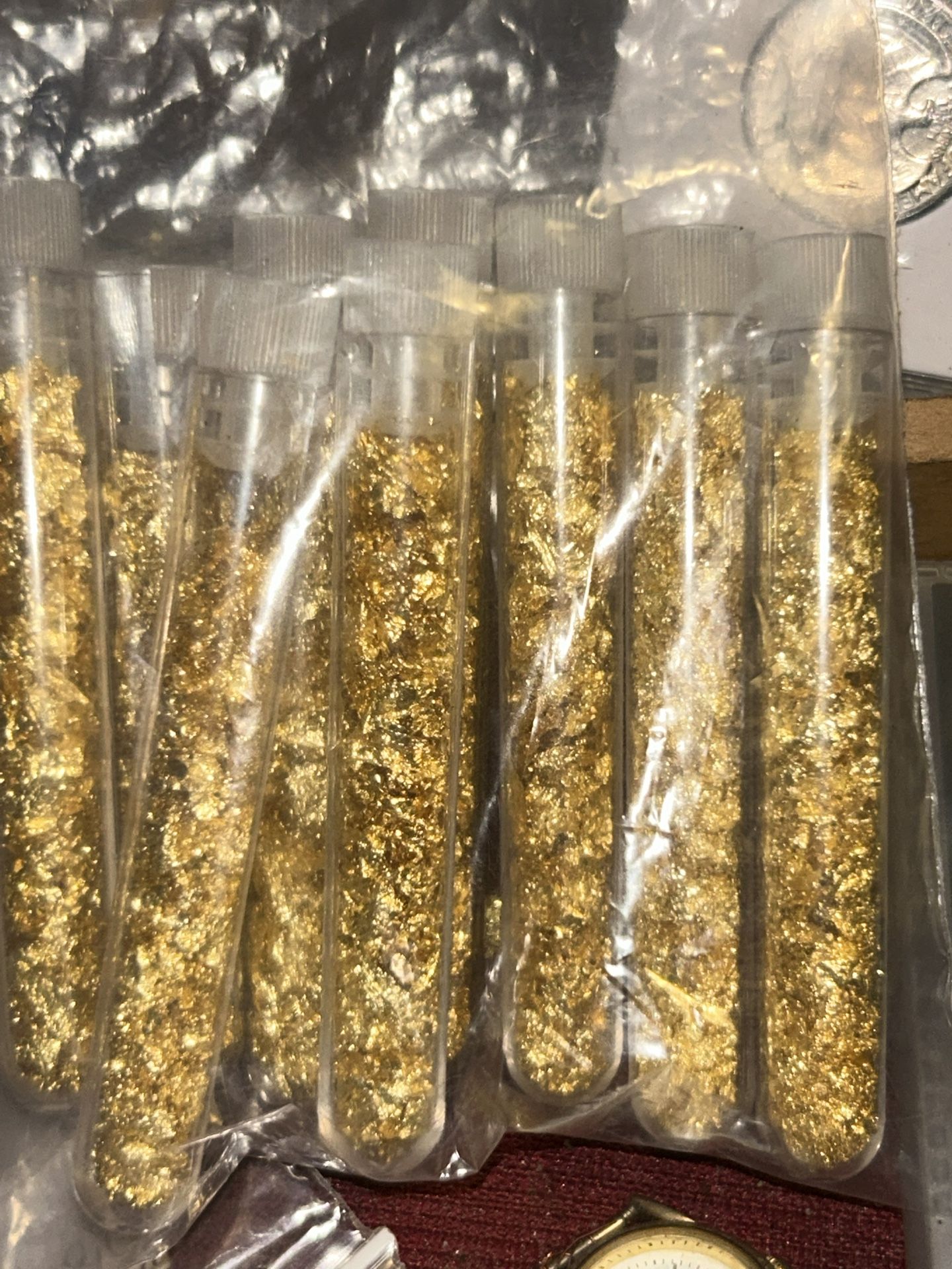 Nine individual tubes of white/flower gold