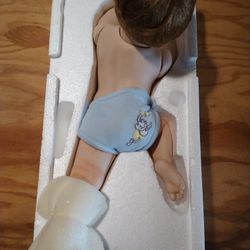 The Ashton-Drake Galleries Snug as a Bug in a Rug Porcelain Baby Doll  