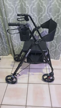 Brand new rollator / walker with under seat storage and cell phone holder