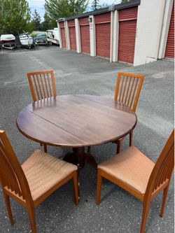 Round wooden table and four chairs
