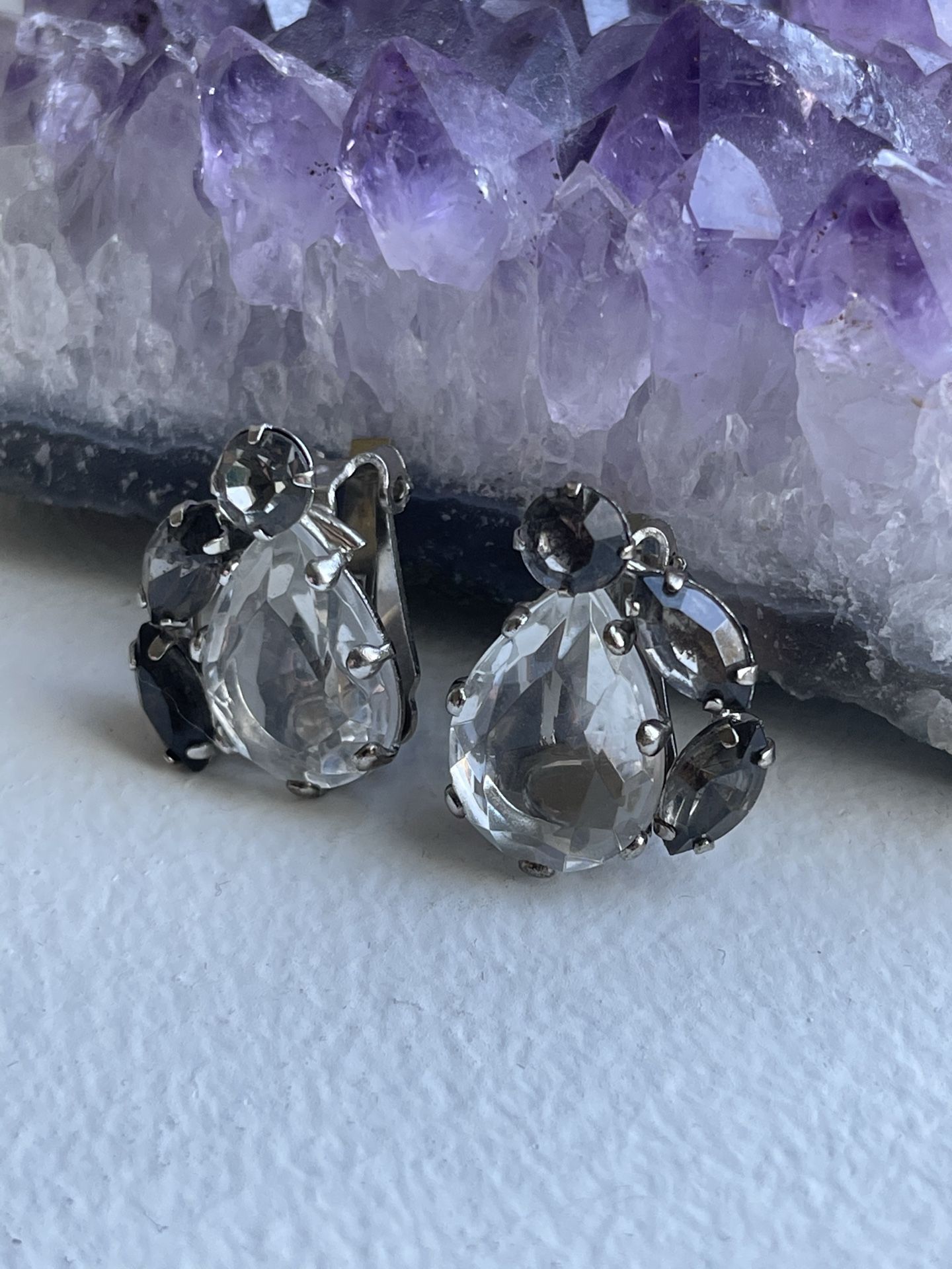 Tear drop shaped, clip-on earrings with 1 center piece clear stone, and 3 side pieces clear stones