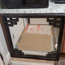 34 by 34 mirror. Weights 25 pounds.