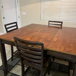 Brown kitchen table with 5 chairs, rug at the bottom just a bonus.