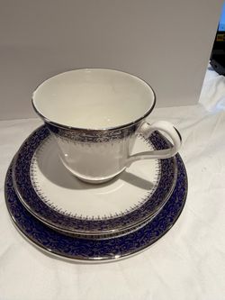 Porcelain Tea Cup, Saucer, and Side Plate Set