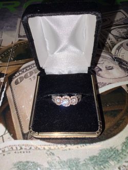 F32-000-452 14K TWO TONE THREE STONE HALO DIA RING