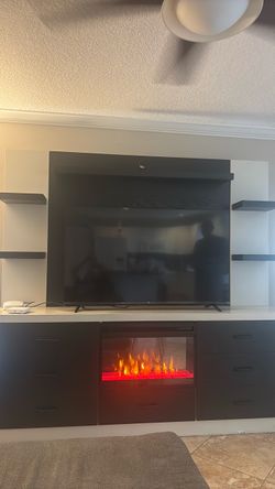 Entertainment center with heated fire place