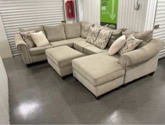 Free Delivery - Beautiful Sectional and Ottoman Set