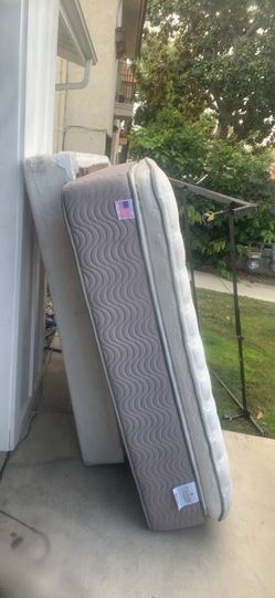 Complete king, size bed, mattress, boxspring, headboard, and base frame