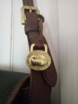 Authentic Vintage Gold Tone Donney  &  Bourke Fob and original purse. One price!