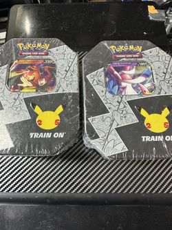Pokémon Celebrations Lance's Charizard V and Dark Sylveon V Tin Bundle