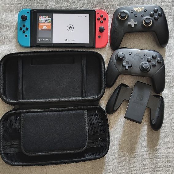 Nintendo Switch with 12 Games, Two Pro Controllers, Carrying Case, and Portable Dock