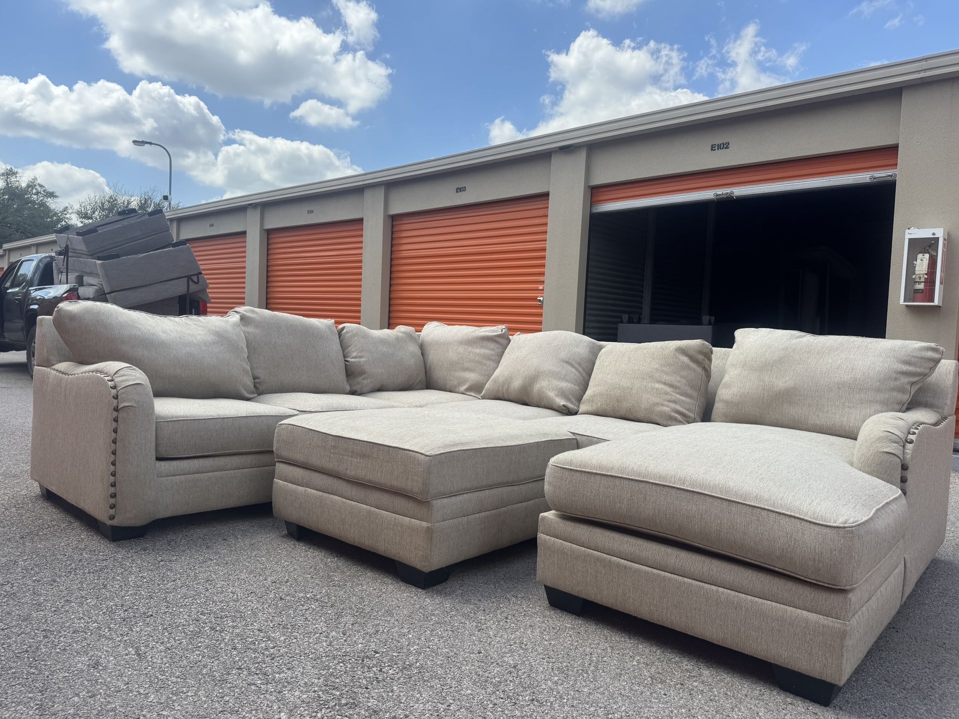 Tan Sectional With Ottoman