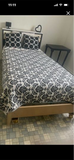 Black and white Twin bed with mattress