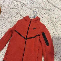 Red Nike tech fleece