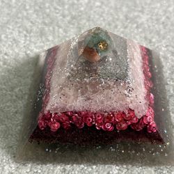 Handmade Orgonite pyramid  made with resin metal filings, pink sequins, glitter, and crystals
