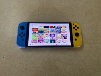 Nintendo Switch OLED ith 125 POPULAR SWITCH GAMES