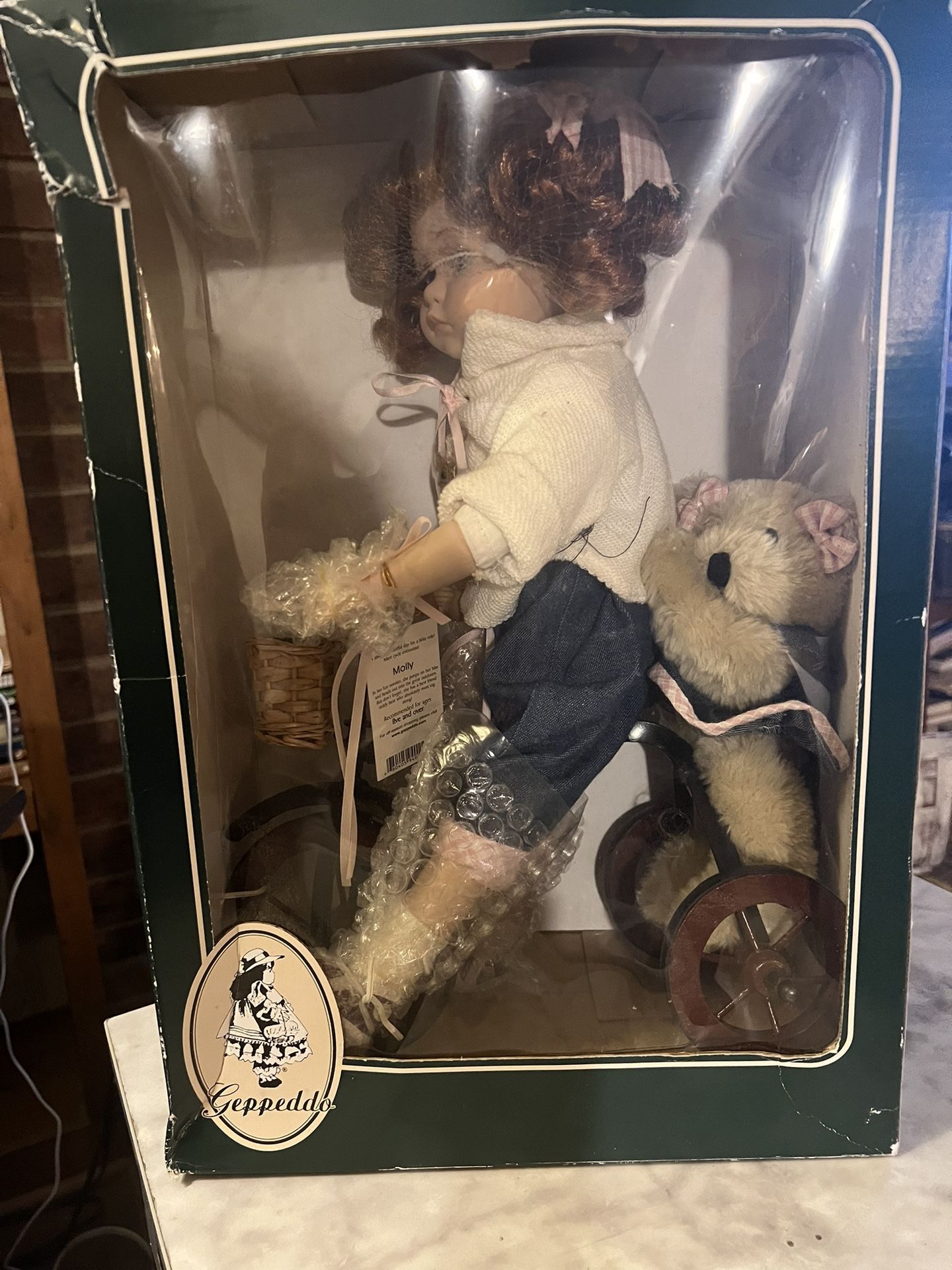 Geppeddo Porcelain Doll “Molly” Riding Tricycle with Bear