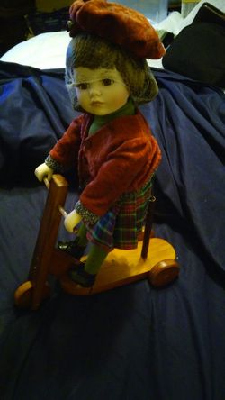 Porcelian Doll on Bike