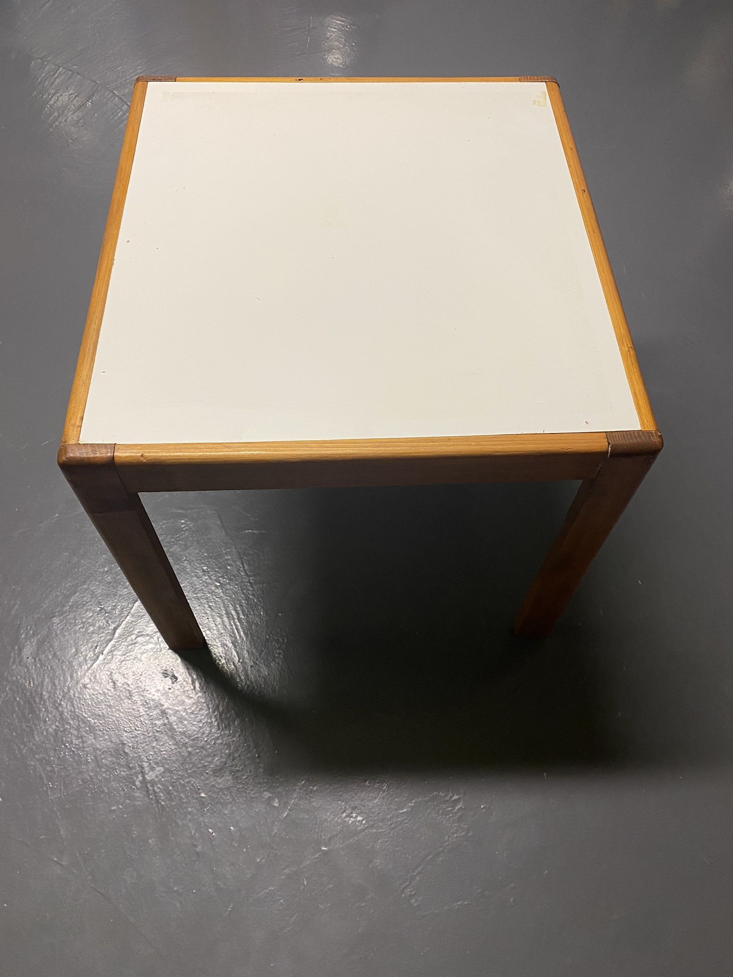 Wooden table with white top