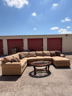 Tan sectional sofa with chaise end coffe table