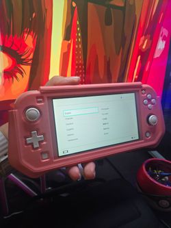 Nintendo switch lite coral pink with cover