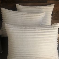 3 White decorative pillows
