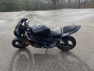 Kawasaki Ninja 636 Motorcycle With Helmet  Thumbnail
