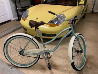 Huffy Cranbrook 26” wheel, single speed, rear coaster brake and padded spring saddle.