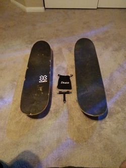 2 skateboards and a skate tool