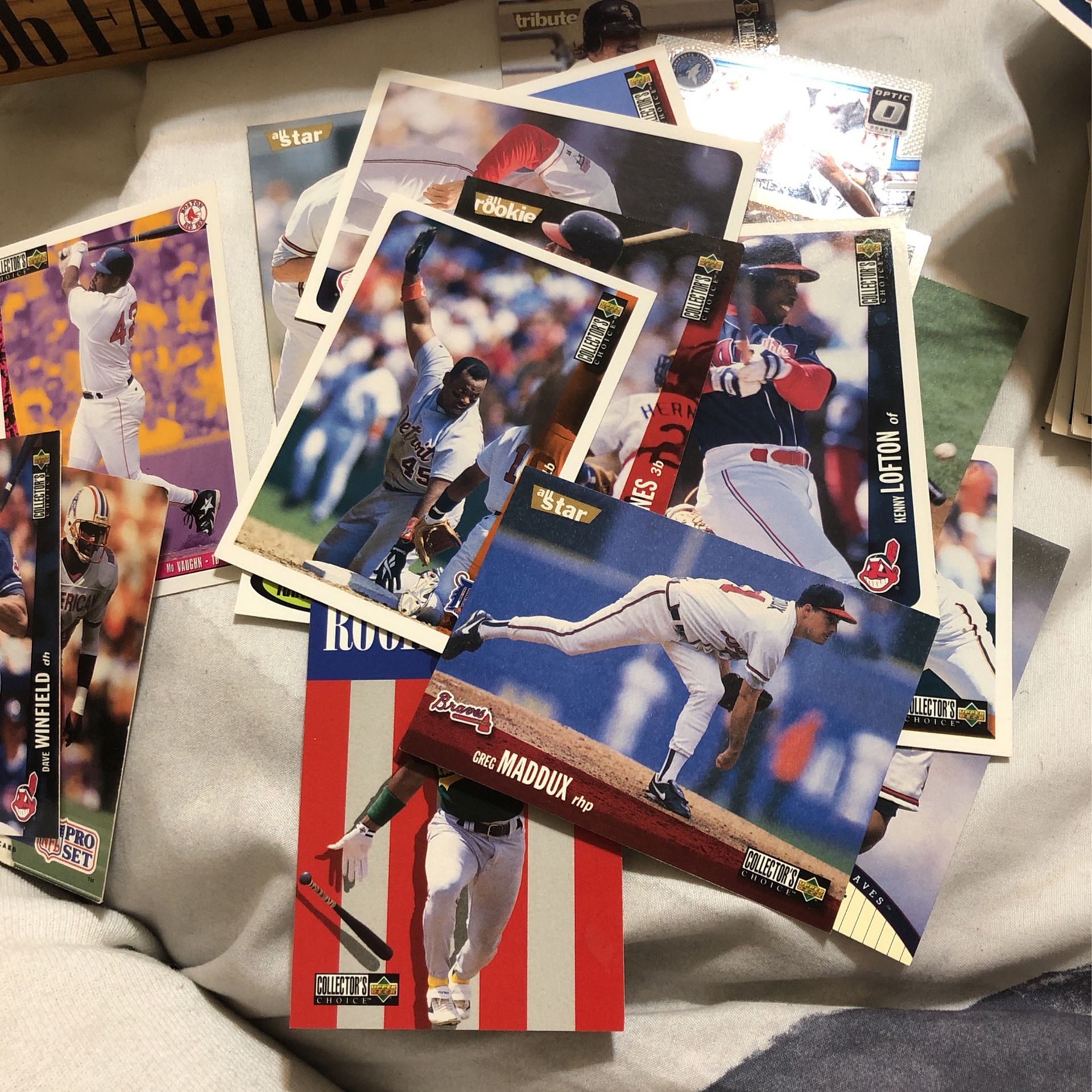 Baseball football and basketball cards