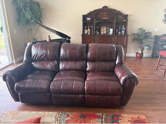 Dark brown leather sofa and loveseat