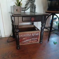 end table with Winchester box